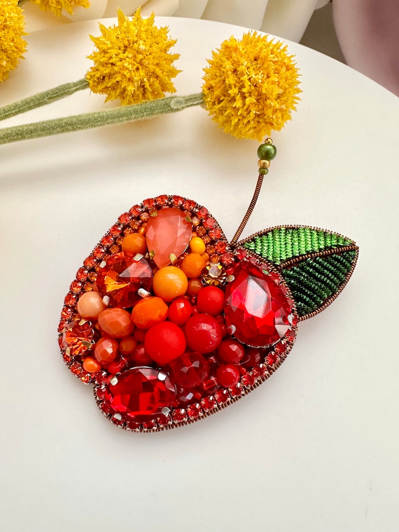 Hand-embroidered brooch ‘’Orange Apple". Handmade colorful pin brooch. Designer accessories.