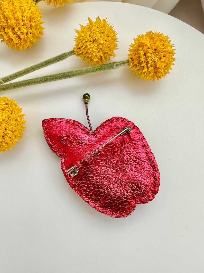 Hand-embroidered brooch ‘’Orange Apple". Handmade colorful pin brooch. Designer accessories.