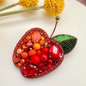 Hand-embroidered brooch ‘’Orange Apple". Handmade colorful pin brooch. Designer accessories.