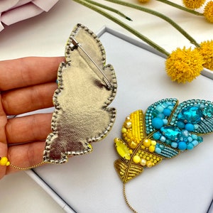 Beaded brooches Ukrainian Yellow Blue feather. Handmade designer brooch. High quality accessories. Unique design brooch.