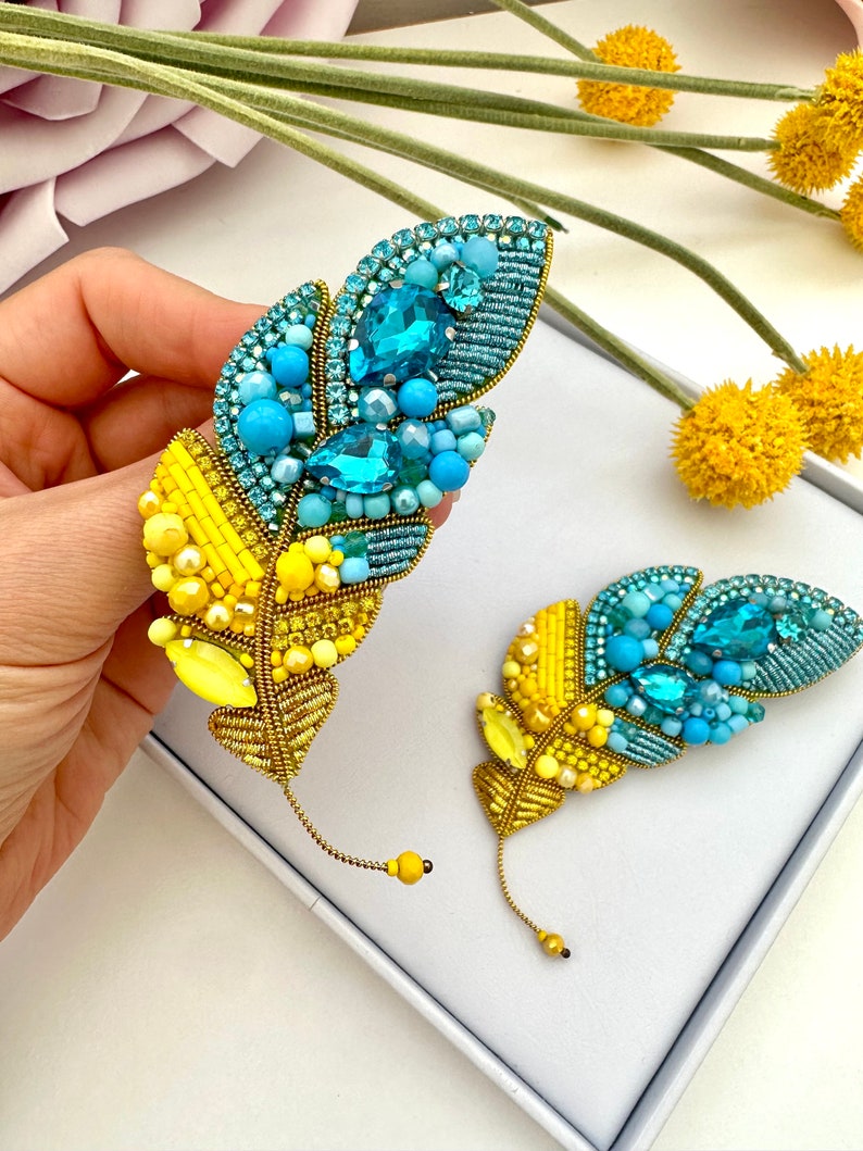 Beaded brooches Ukrainian Yellow Blue feather. Handmade designer brooch. High quality accessories. Unique design brooch.
