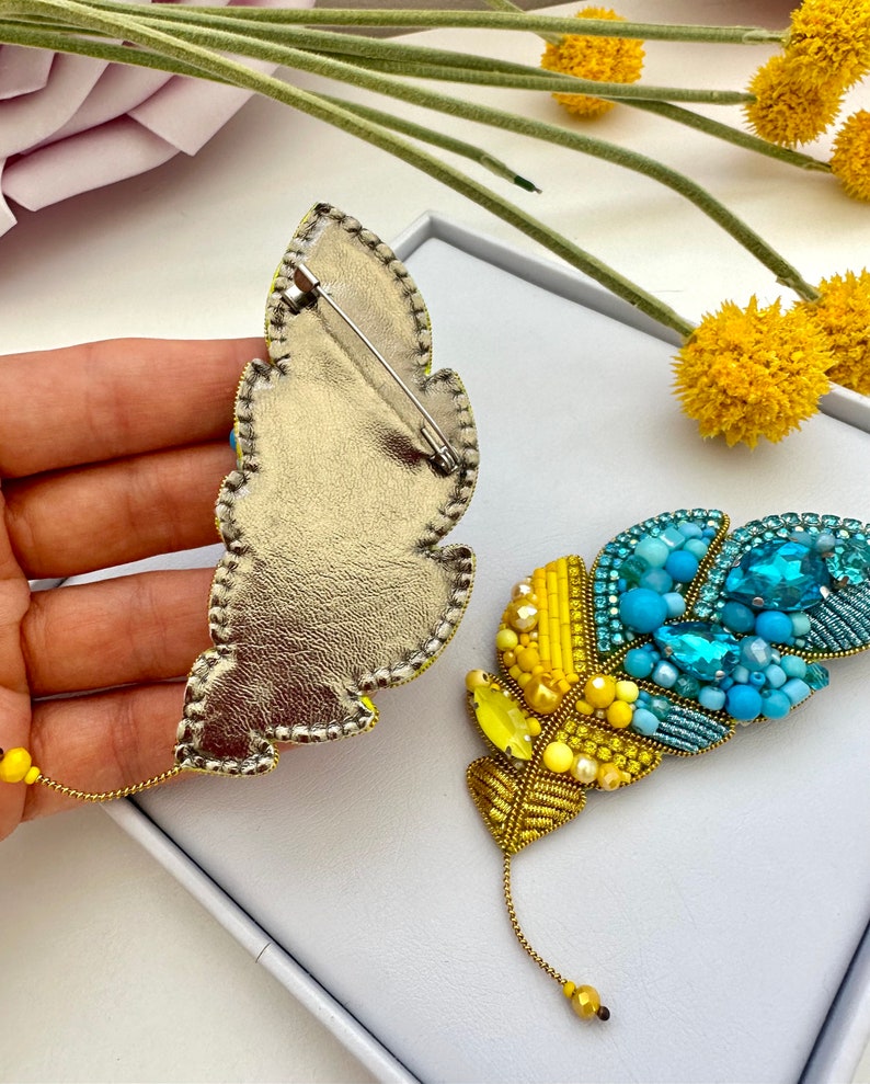 Beaded brooches Ukrainian Yellow Blue feather. Handmade designer brooch. High quality accessories. Unique design brooch.